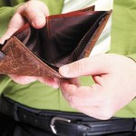Empty wallet in male hands - poor economy